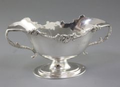An Edwardian silver two handled double lipped sauce boat, hallmarked London 1909, makers George