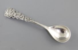 A George V Arts & Crafts cast planished silver spoon, by Omar Ramsden, hallmarked London 1932, the