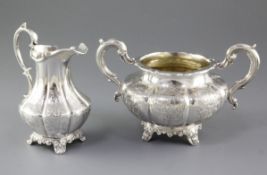 An early Victorian silver sugar basin and tall cream jug, by William Hunter, hallmarked London 1852,