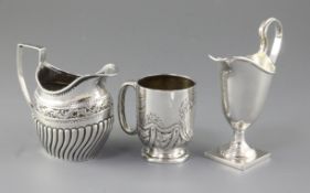 A Victorian demi spiral fluted silver cream jug, by Josiah Williams & Co, hallmarked London 1892,