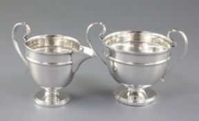 A George V silver sugar pedestal bowl and cream jug, by Viner's Ltd, hallmarked Sheffield 1932 and