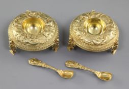 A good pair of Victorian cast silver gilt salt cellars and spoons, by Jane Brownett? hallmarked