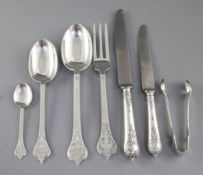 A George V silver canteen of 17th century style lace back trefid pattern cutlery, principally by