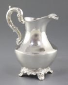 An early Victorian silver cream jug, by William Hunter, hallmarked London, 1856, of plain, shaped