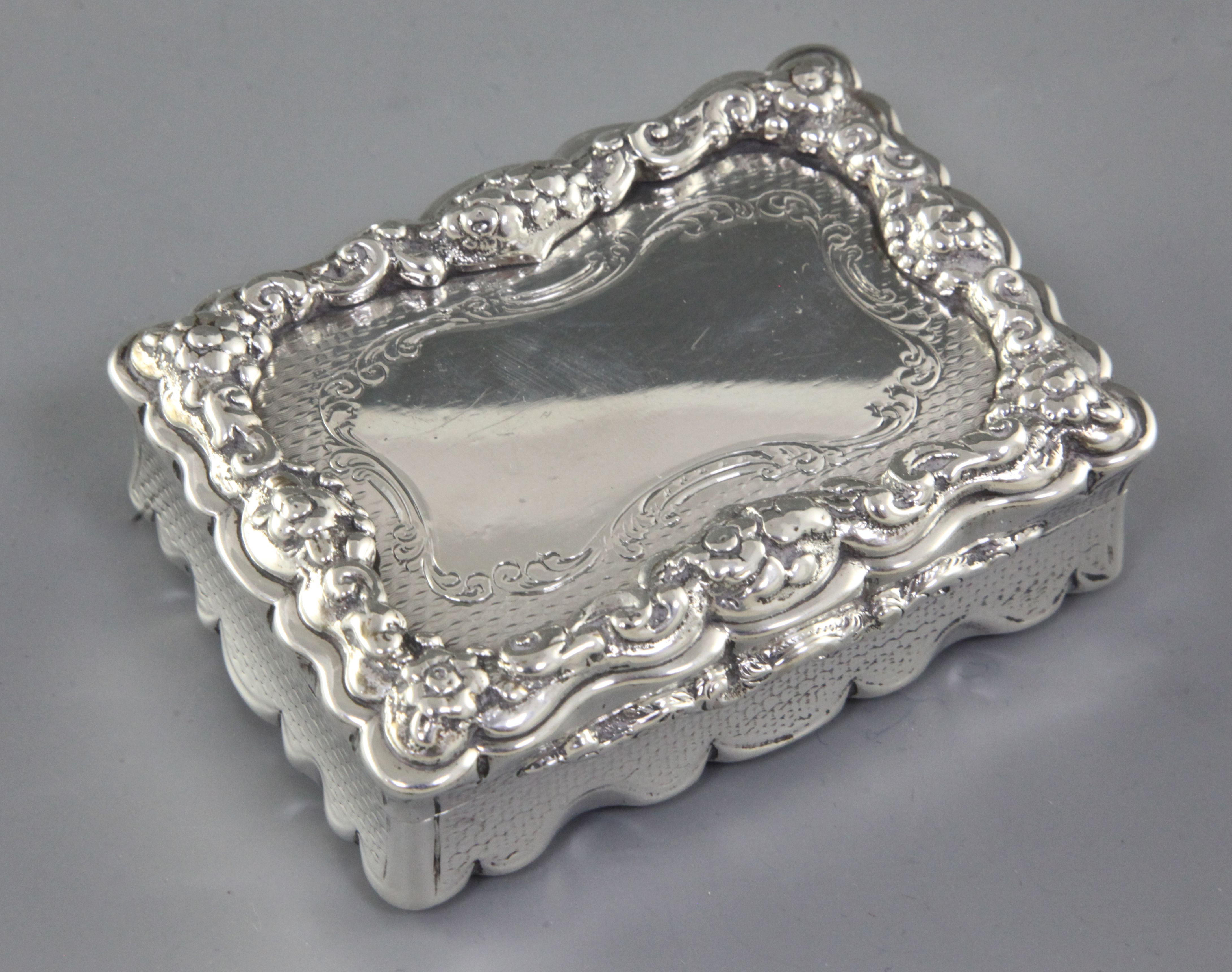 A Victorian silver rectangular table snuff box, by Yapp & Woodward, hallmarked Birmingham 1850, with