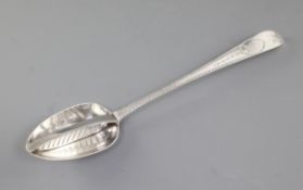 A George III Irish silver strainer spoon, by John Osborne, hallmarked Dublin 1791, with bright cut