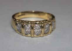 A 14ct gold and diamond gentleman's ring, with five panels of four small diamonds in claw settings