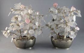 A pair of Chinese rock crystal flower ornaments, 19th century, on silvered bases, height 13.5in.