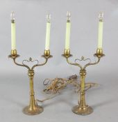 A pair of early 20th century gilt brass twin-branch table lamps in the manner of W.A.S.Benson Height