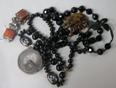 A white metal and hardstone bracelet, a black enamel? bead necklace with two cloisonne beads and