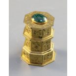 A gilt metal inkwell, c.1840, scroll engraved, of layered hexagonal form surmounted by an oval