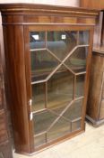 A mahogany hanging corner cabinet, W.78cm