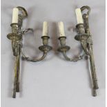 A pair of Victorian ormolu twin branch wall lights decorated with eagles and tassels H.22in.