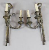 A pair of Victorian ormolu twin branch wall lights decorated with eagles and tassels H.22in.