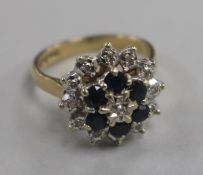 A 1970's 9ct gold, sapphire and diamond cluster dress ring, size L.