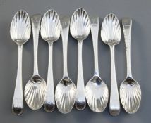 A harlequin set of eight George III silver feather edge pattern teaspoons, with scallop bowls and