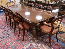 A Victorian style mahogany extending table and ten mahogany chairs 8ft 8in. x 3ft 8in.