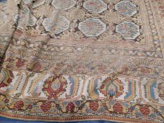 A large Indian carpet, circa 1910, the charcoal field with overall octagons enclosing flower sprays,