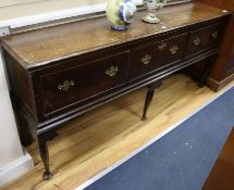 A mid 18th century oak dresser base, with three drawers on cabriole legs with pad feet, W.6ft D.