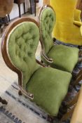 A pair of Victorian mahogany green buttonback nursing chairs