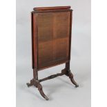 A Regency mahogany firescreen with sliding panels, H.3ft 6in. W.1ft 11in.https://www.gorringes.co.