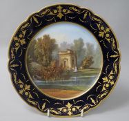 A Sevres cabinet plate, painted with a view titled to underside 'Pavillon de Musique à Trianon',
