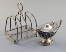 An Edwardian silver mustard and a late Victorian four division toastrack, 9.7 oz.https://www.