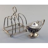 An Edwardian silver mustard and a late Victorian four division toastrack, 9.7 oz.https://www.