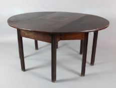 A George III mahogany double gateleg table on moulded square legs opens to 2ft 4in. x 4ft 11in.