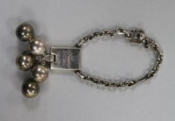 A white metal key ring fob, inscribed "S.J. Dupont, Paris, 1789-1989.