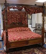A large George III style mahogany four poster bed with hangings W. 6ft 6in. H.7ft 7in.