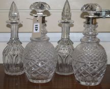 A pair of silver coloured decanters and two others H.29.5cm