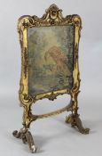 A Victorian giltwood firescreen with tapestry panel depicting an eagle 2ft 10in. H.3ft 10in.