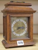 An oak mantel clock 8.5ins