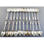 A harlequin set of twenty two William IV silver fiddle and shell pattern teaspoons, engraved with