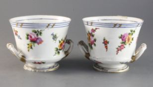 A pair of 19th century Sevres style porcelain cache pots decorated with floral sprigs 4.5in.