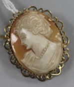 A 9ct gold-mounted cameo brooch with safety chain by EJCY & Co