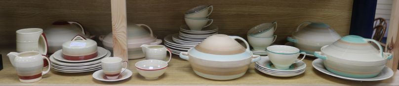 A large quantity of Susie Cooper striped dinner wares in various colours