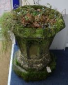 A Victorian weathered composition octagonal garden urn, on matching plinth, H.2ft 1in.