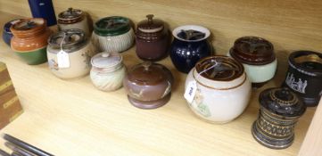 A Bourne Denby moulded tobacco jar and fifteen other tobacco jars, various (16)