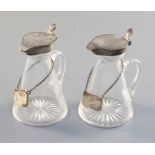 Two Edwardian silver mounted glass whisky flagons, Hukin & Heath, Birmingham, 1902 & 1906,with