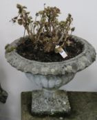 A pair of weathered composition garden urns, H.1ft 3in. Diam.1ft 8in.