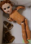 A French bisque headed doll, mittens and shoes 11.5ins