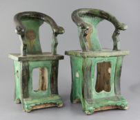 A near pair of Chinese sancai pottery models of horseshoe backed chairs, Ming dynasty, with openwork