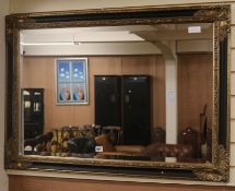 A modern gilt wall mirror, W.105cm