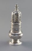 A George I baluster silver caster, with moulded bands to neck and shoulder, engraved armorial and