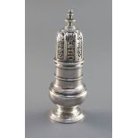 A George I baluster silver caster, with moulded bands to neck and shoulder, engraved armorial and