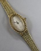 A ladies' 9K gold (375) Tissot 'Sari' wristwatch on woven bracelet, with oval silvered dial