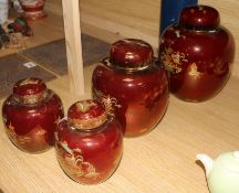 Two Carlton Ware Rouge Royale Pagoda ginger jars and covers and a smaller similar pair (one cover