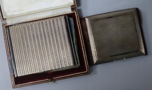 Two parcel gilt silver cigarette cases including one with import marks for Fortnum & Mason , London,